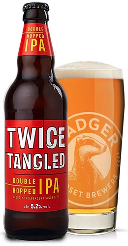 bottle and pint glass filled with badgers twice tangled ipa on plain background