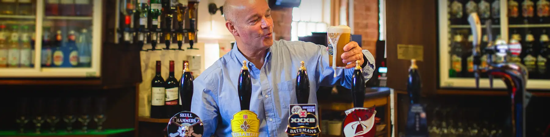 batemans brewery taps and man pouring pint