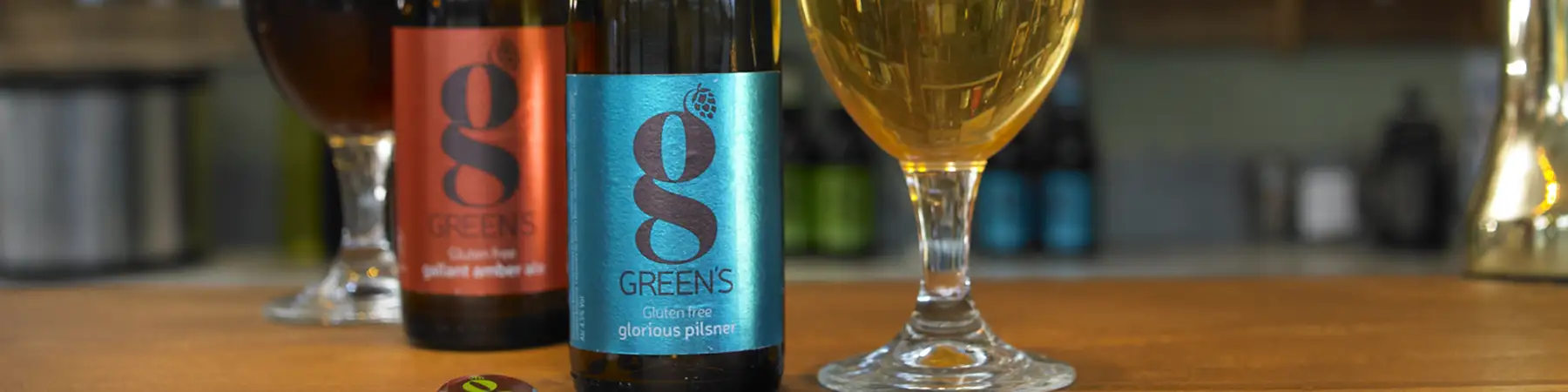 close up of skinny brands label on bottles with pint glass filled