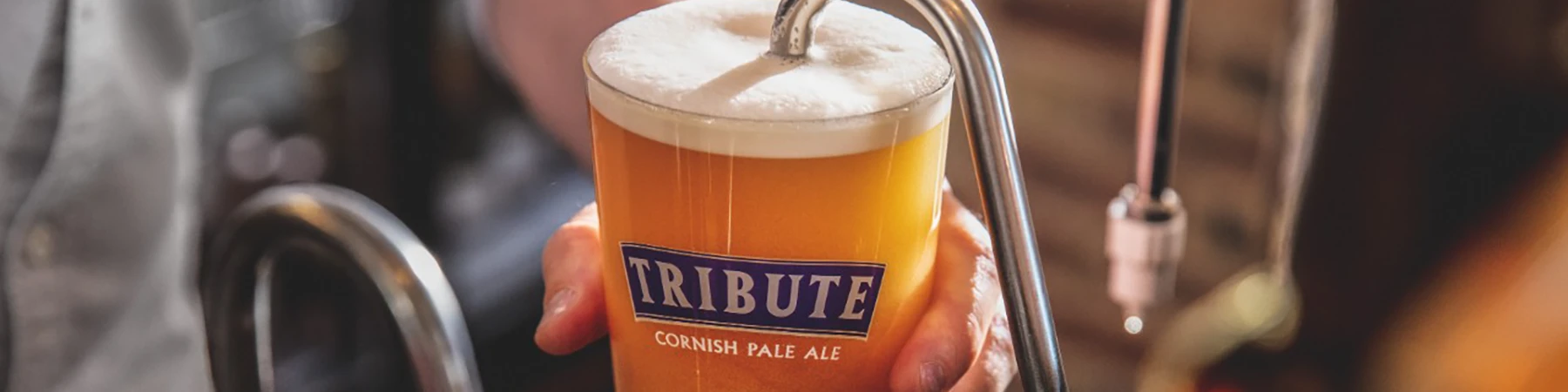 pint of st Austell tribute being poured from tap