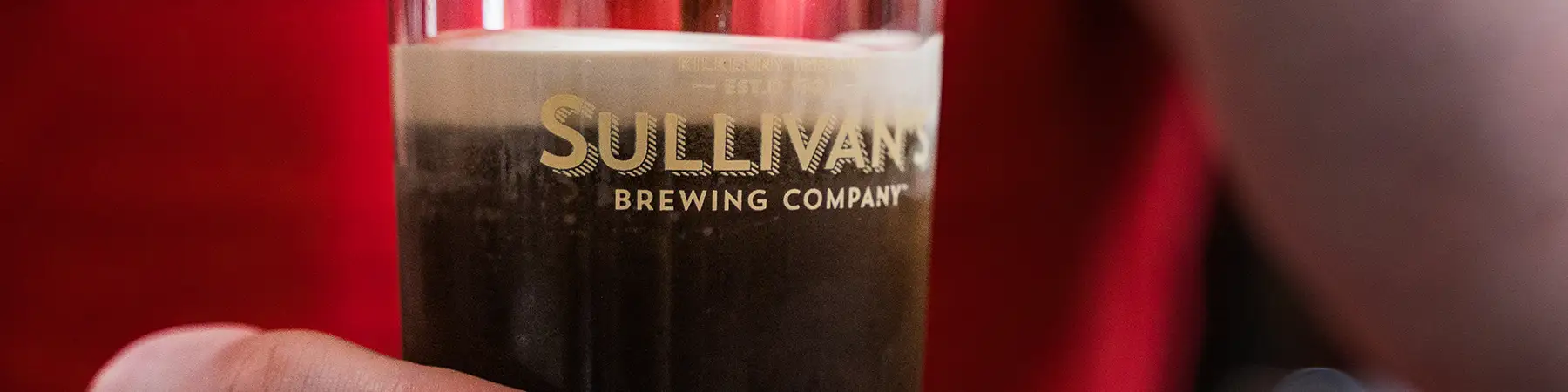 sullivans brewery beer being poured from tap
