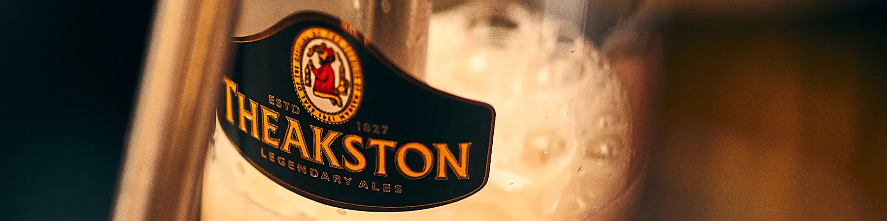 close up of Theakston pint being poured from tap