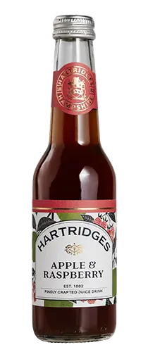 bottle of hartridges apple & raspberry juice on plain background