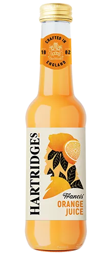 bottle of hartridges orange juice on plain background