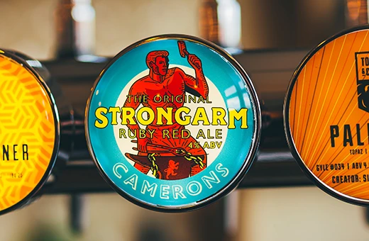 close up of tap logo Camerons strongarm red ale