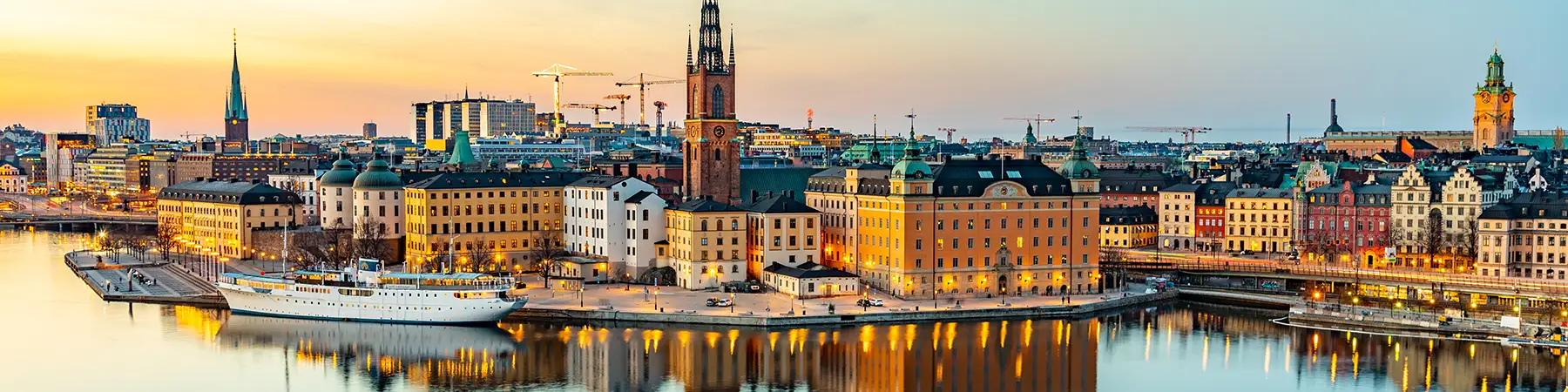 panoramic image of Swedish city on river