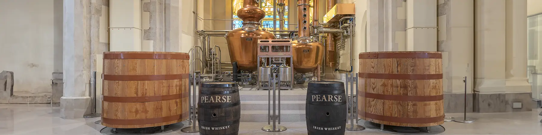 casks and stills inside Pearse Lyons distillery