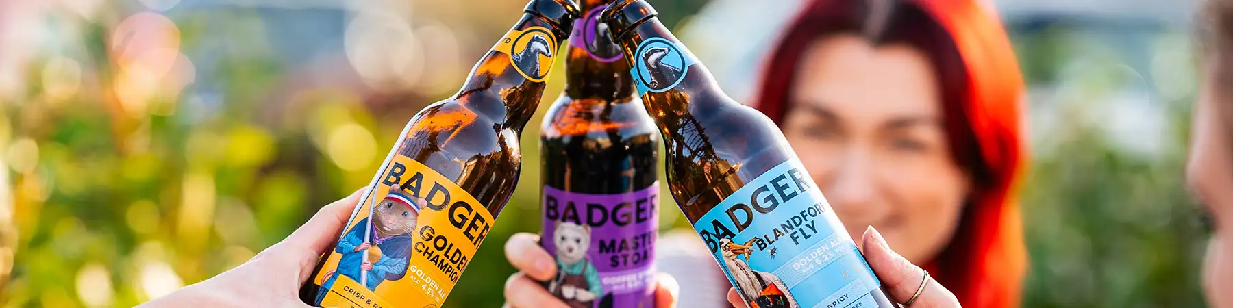 Closeup of group toasting Badger Beers in a Beer Garden